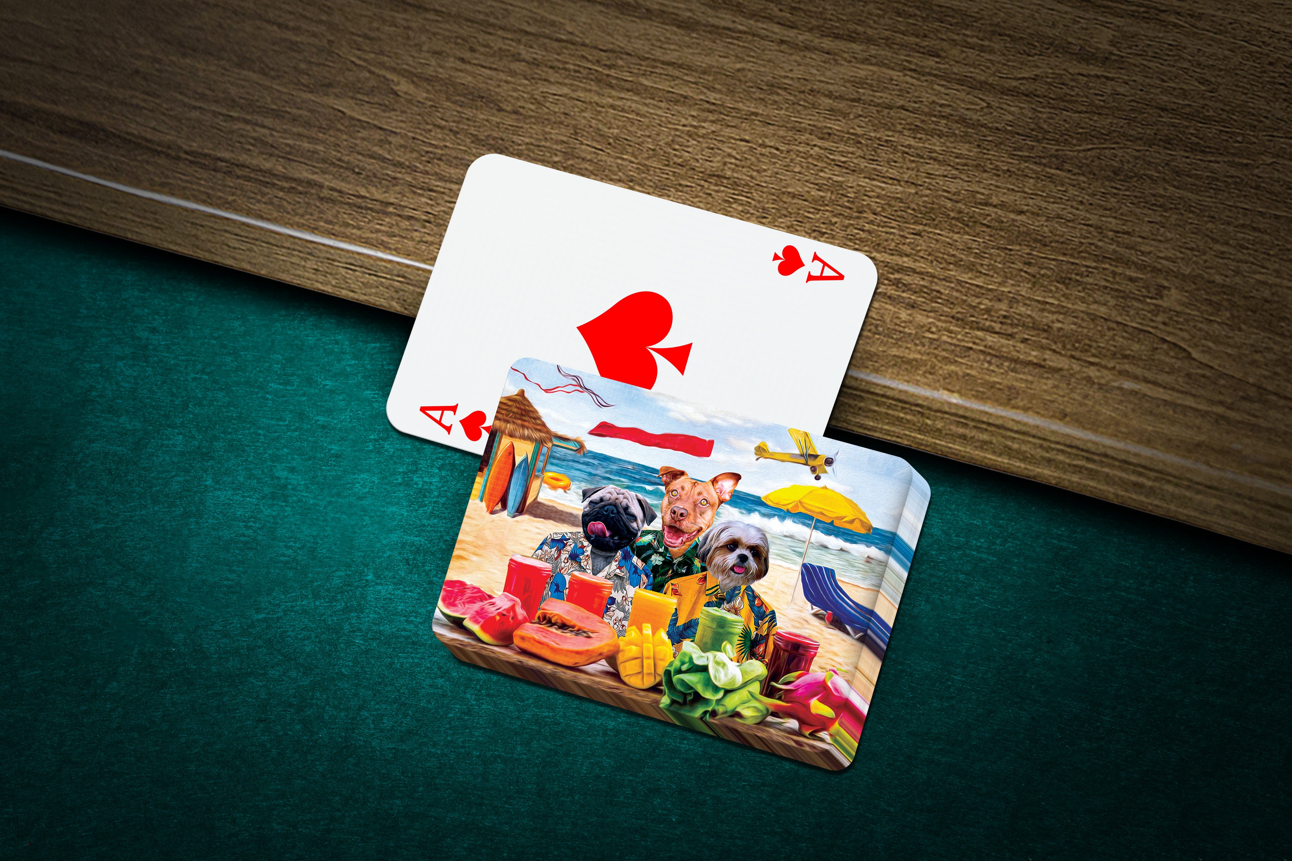 Personalized playing cards featuring three pets in a "Beach Dogs" cartoon style on a green felt table.