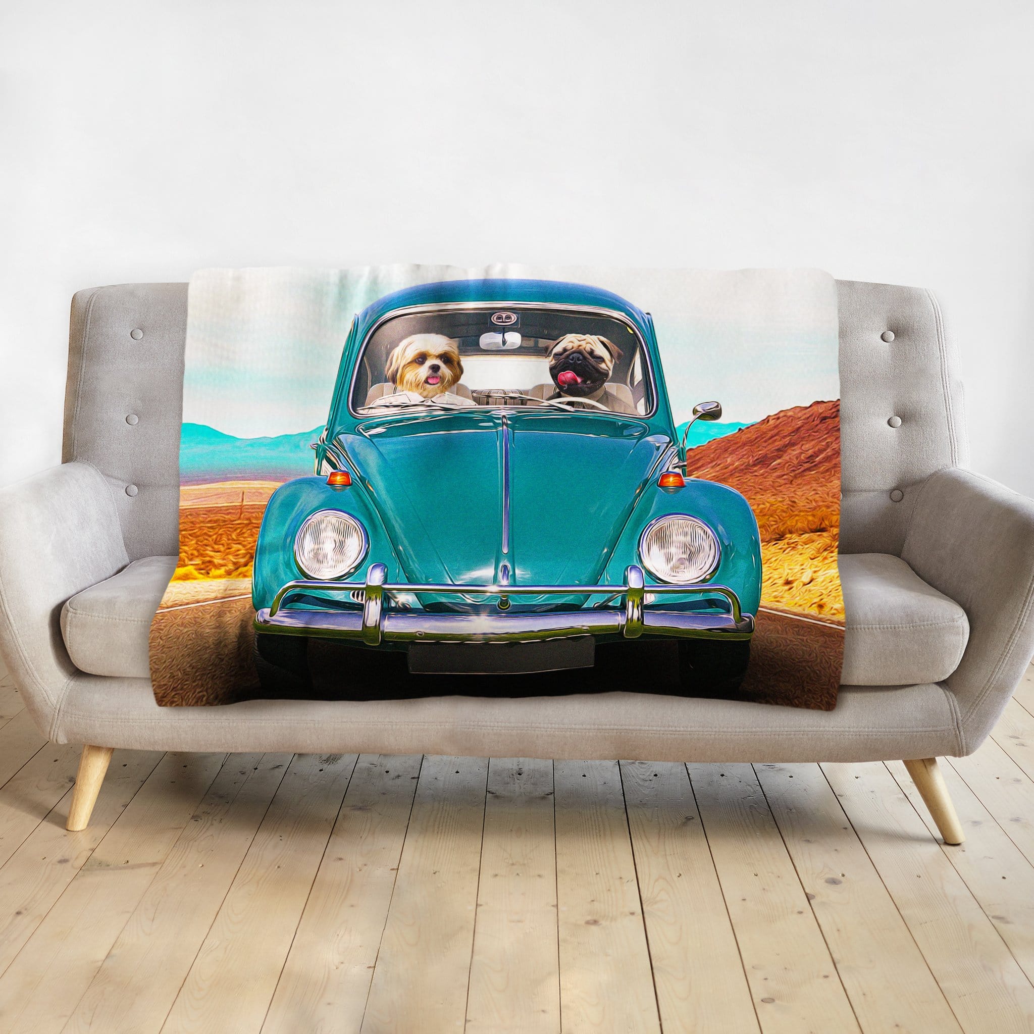 Personalized pet blanket with two dogs in a teal vintage Beetle car on a desert road.