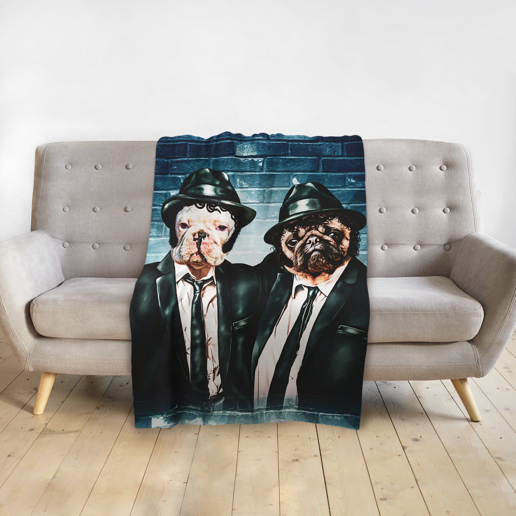 Personalized two-pet blanket featuring dogs in "Blues Doggos" suits against a brick wall.