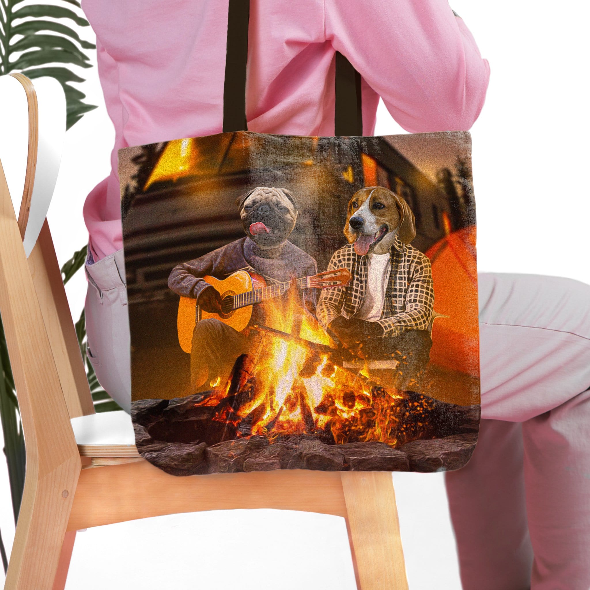 Personalized 2 pet tote bag with custom dog portraits camping by a campfire.