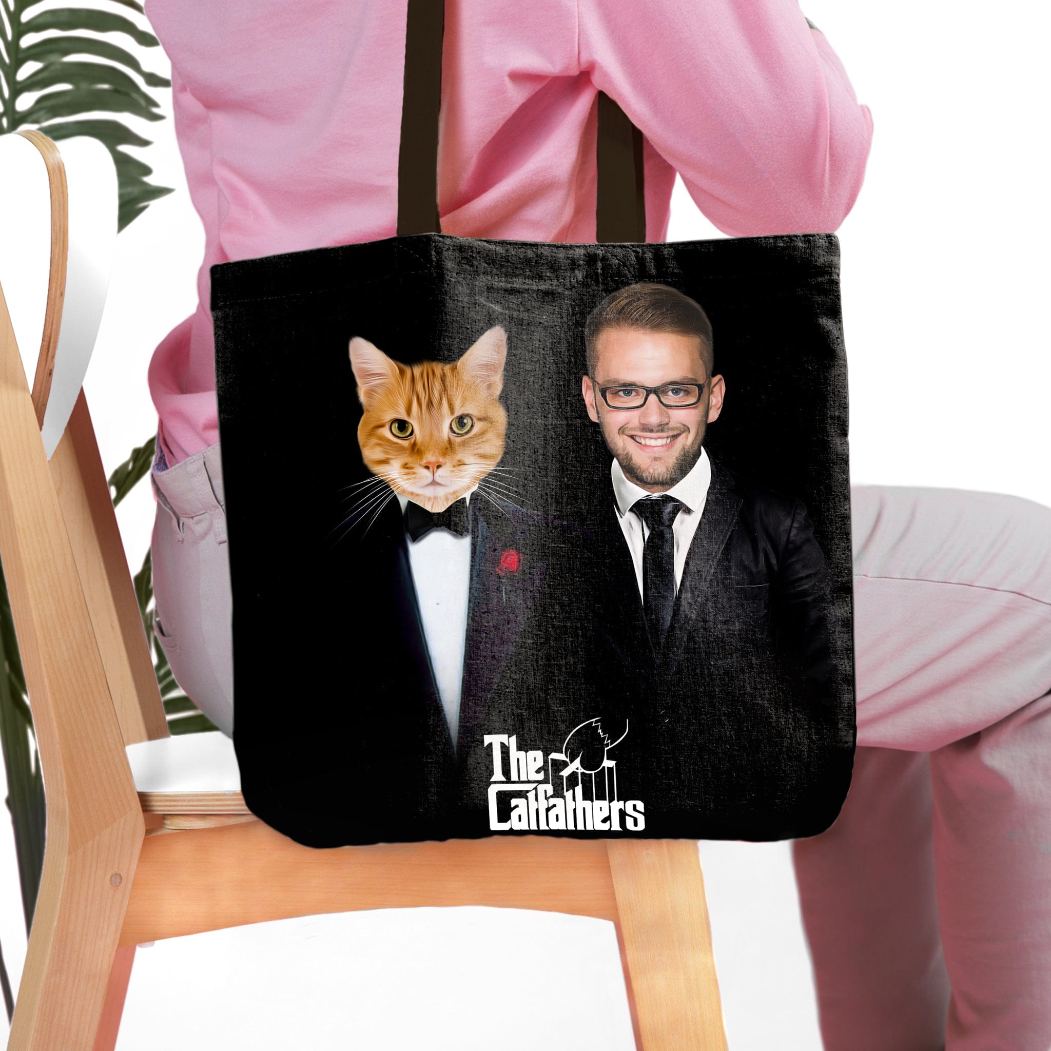 Personalized black tote bag with a custom cat and owner portrait in "The Catfathers" style.