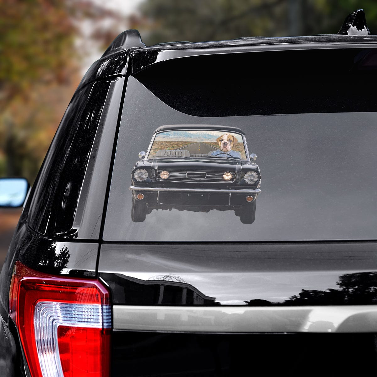 Custom pet decal featuring a bulldog driving a classic black car, applied to a vehicle window.