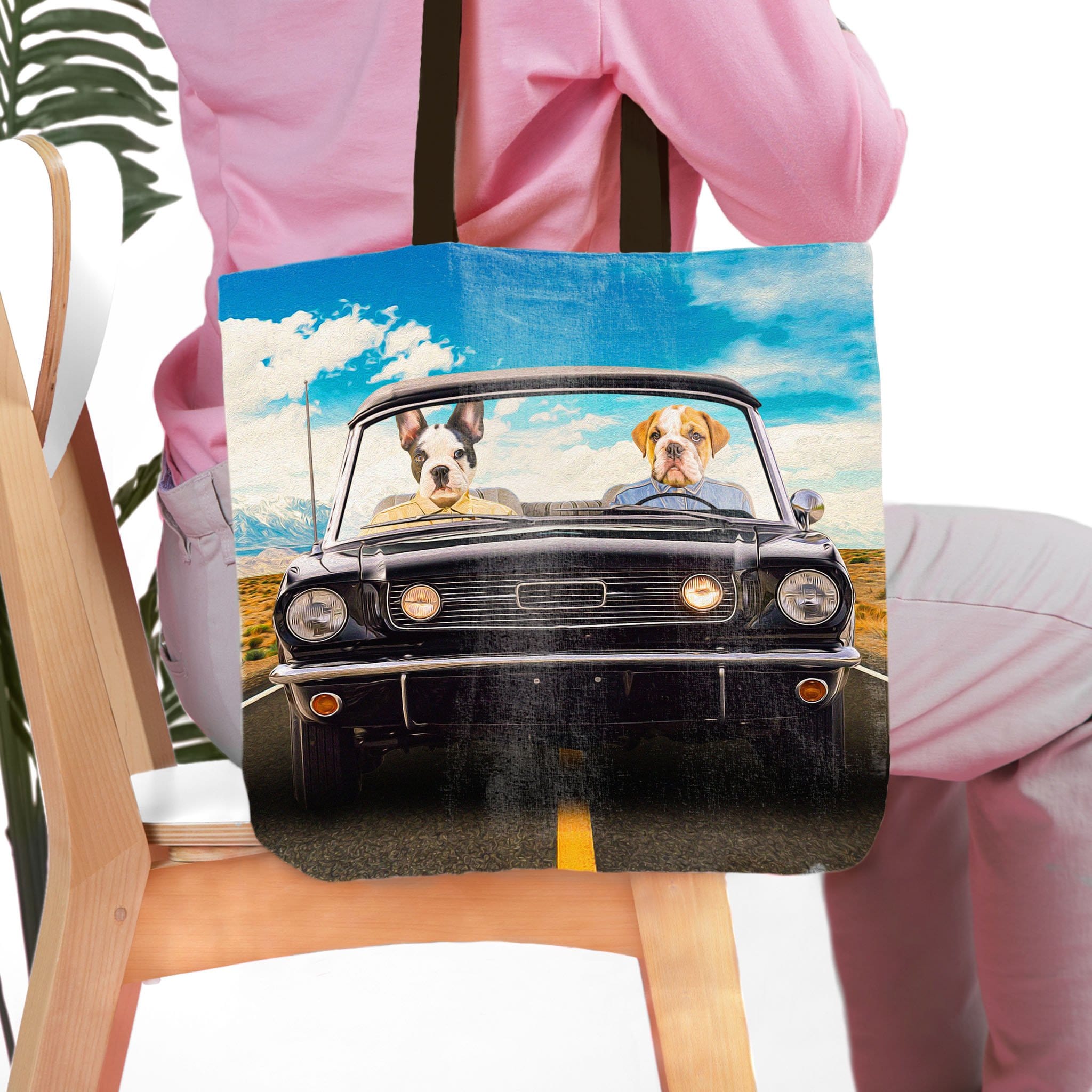 Personalized 2 pet tote bag with custom dog portraits in a classic black car.