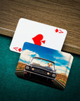 Personalized pet playing cards featuring a dog driving a classic car, on a green felt table.