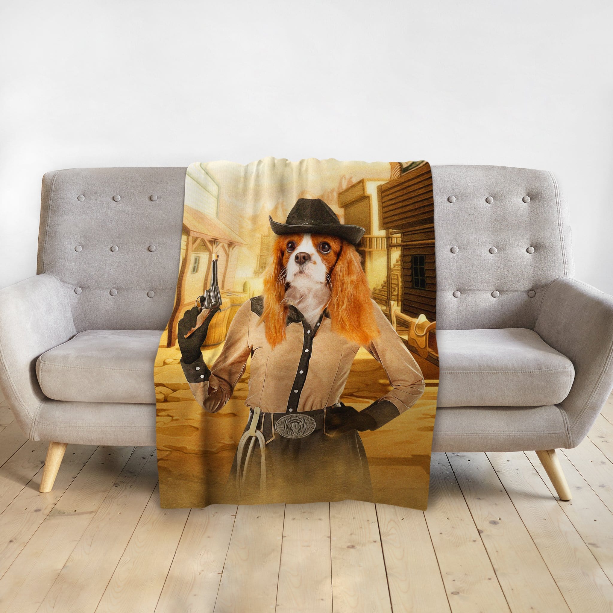 Personalized pet portrait blanket featuring a Cavalier King Charles Spaniel as a cowgirl with a gun.