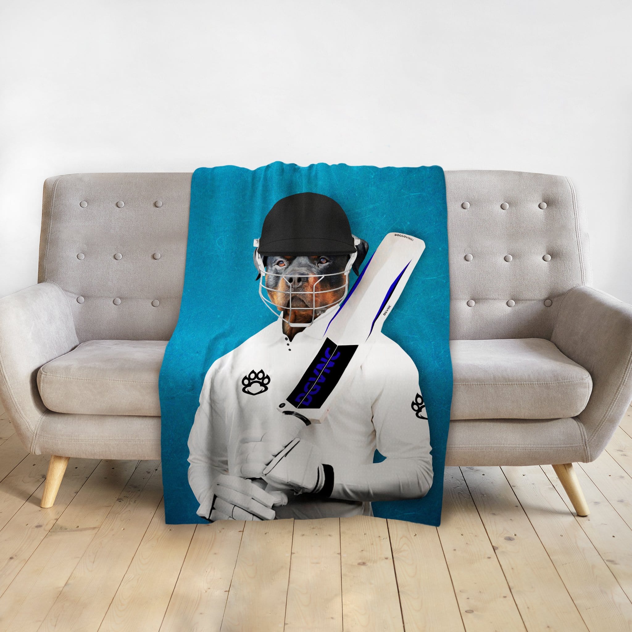 Custom pet portrait blanket featuring a Rottweiler dog as a cricket player on a blue background.