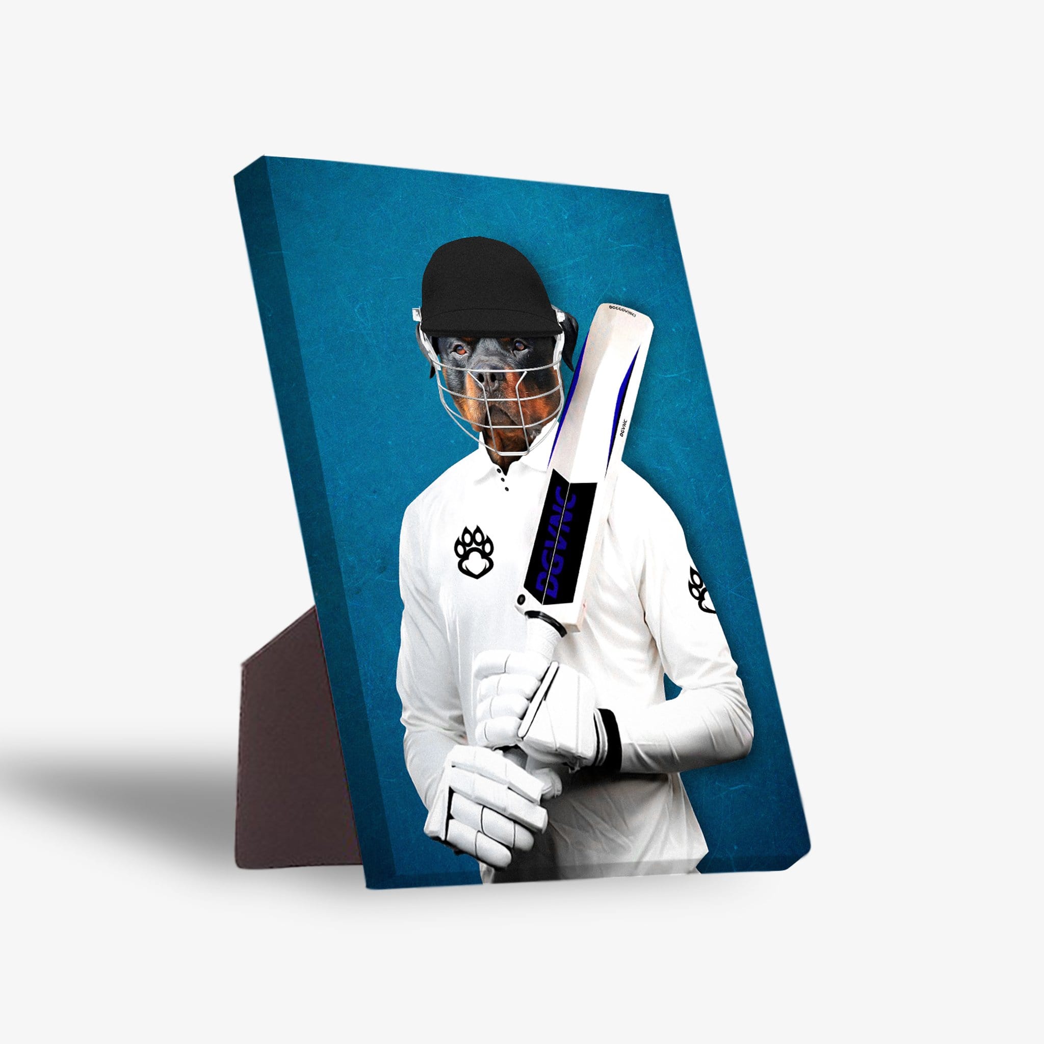 Personalized pet standing canvas featuring a dog's head on a cricket player's body in white uniform, holding a bat, against a blue background.