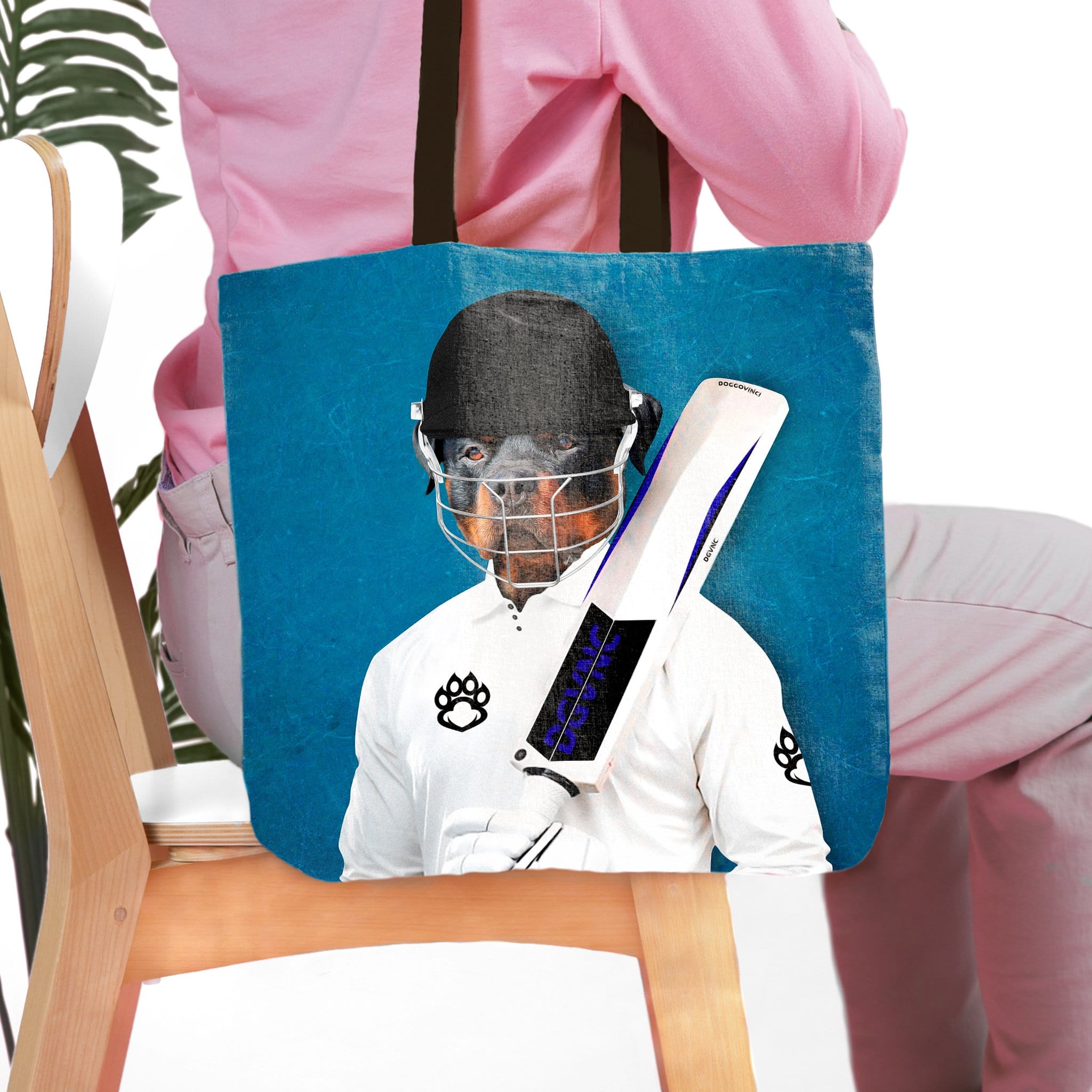 Personalized pet portrait tote bag featuring a Rottweiler in a cricket player uniform.