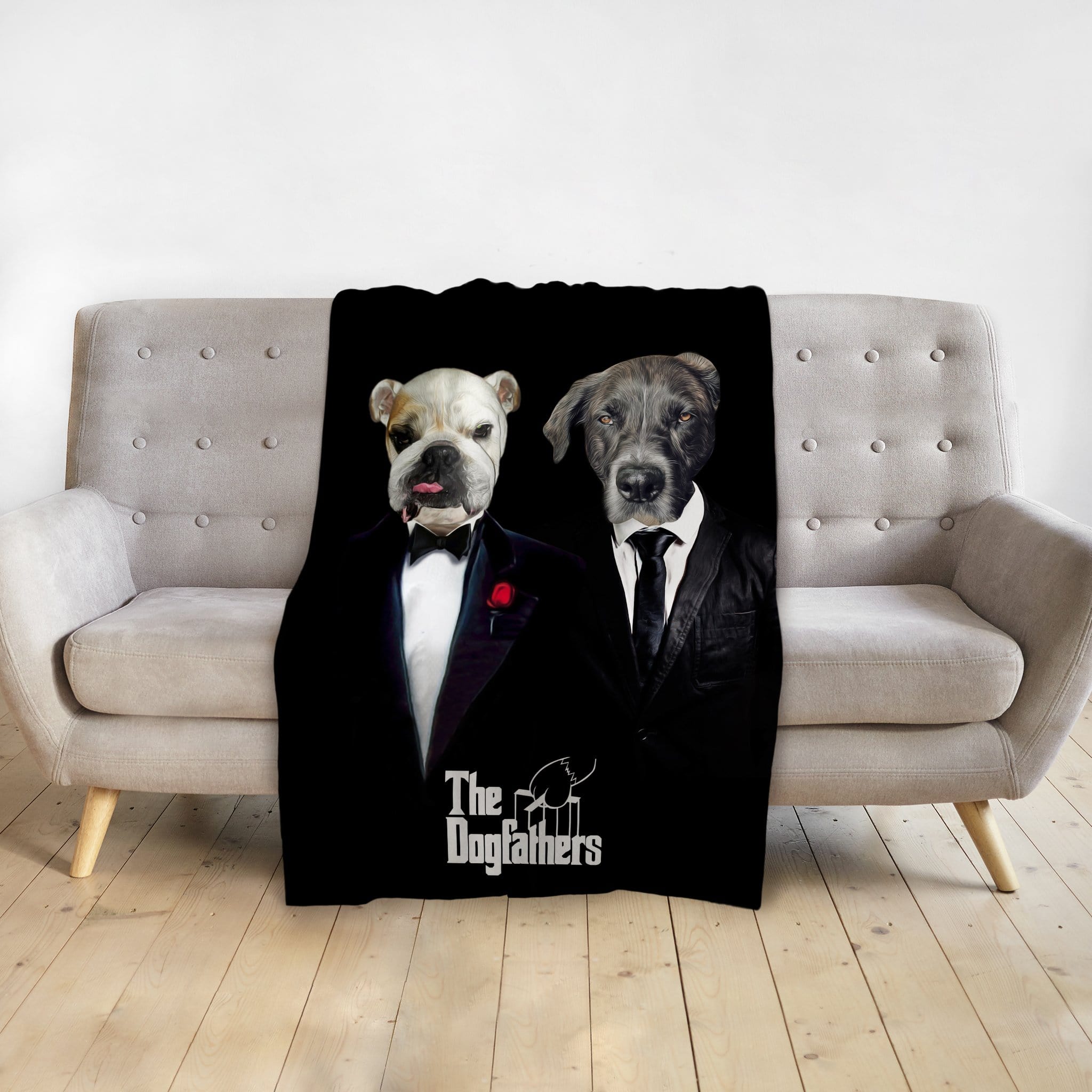 Black personalized pet blanket with two dogs in "The Dogfathers" renaissance-style suits, draped over a sofa.