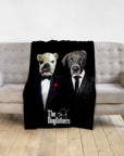 Black personalized pet blanket with two dogs in "The Dogfathers" renaissance-style suits, draped over a sofa.
