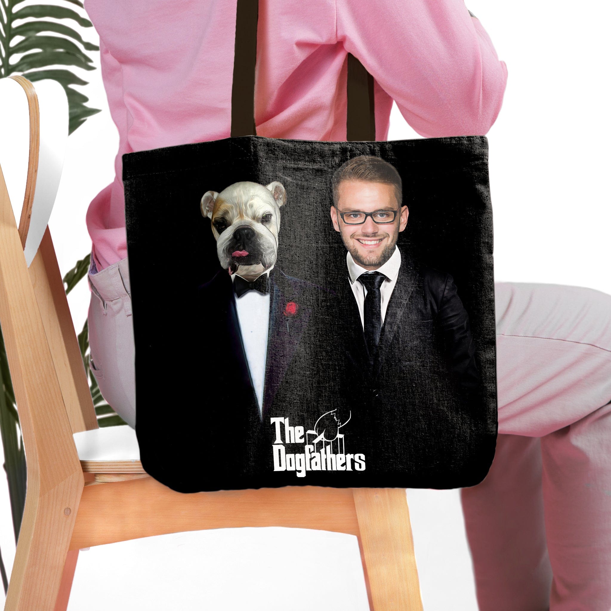 Black personalized 'The Dogfathers' tote bag with custom pet and human portraits in suits.