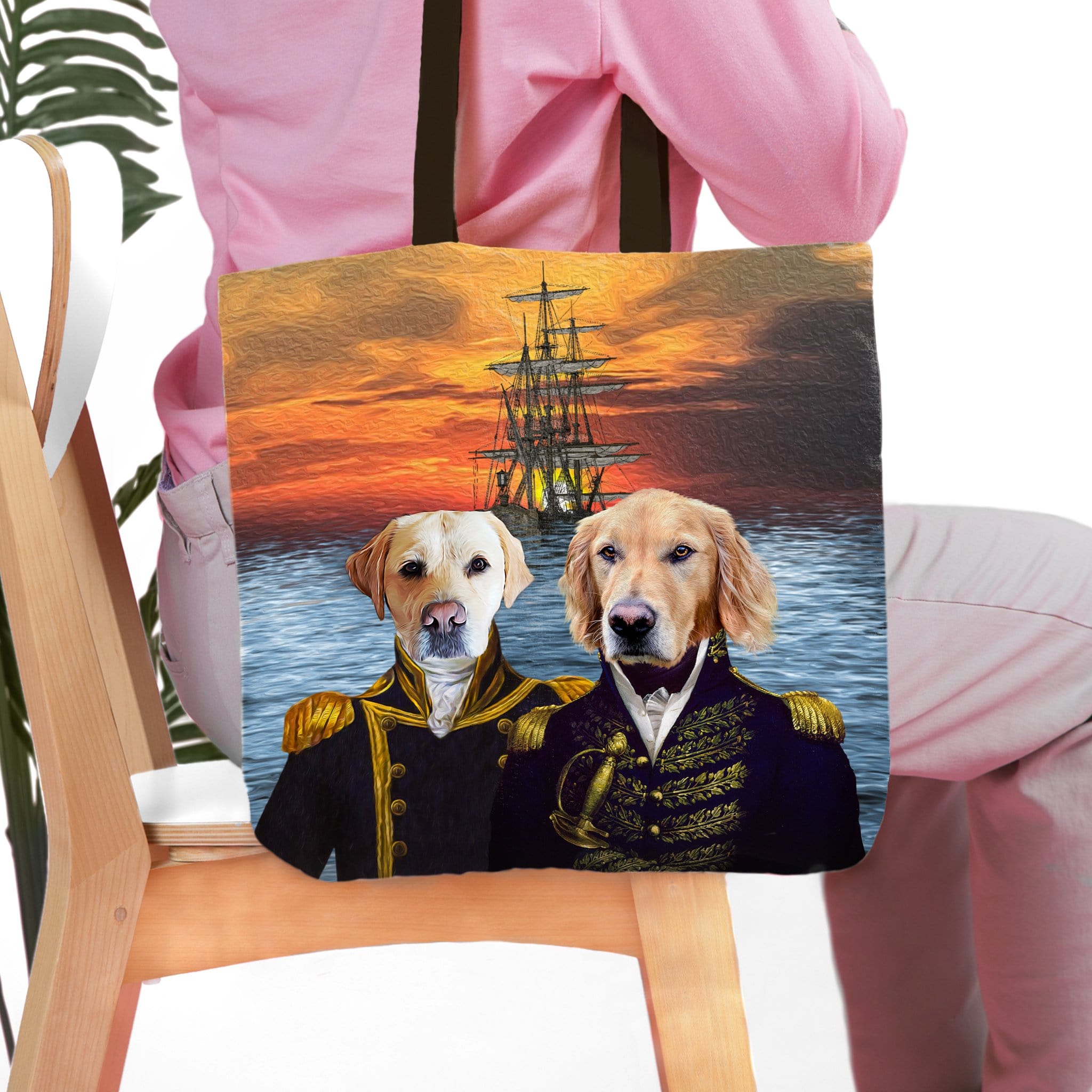 Personalized 2 pet tote bag with custom dog portraits in renaissance naval uniforms against a sunset ship scene.