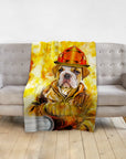 Personalized pet blanket featuring a bulldog in a firefighter uniform portrait, draped over a gray couch.