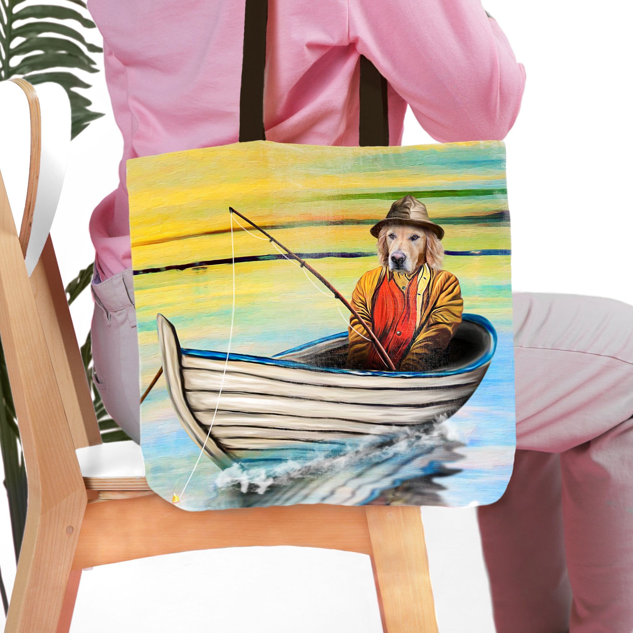 Personalized tote bag with a custom pet portrait of a Golden Retriever dog fishing in a boat.