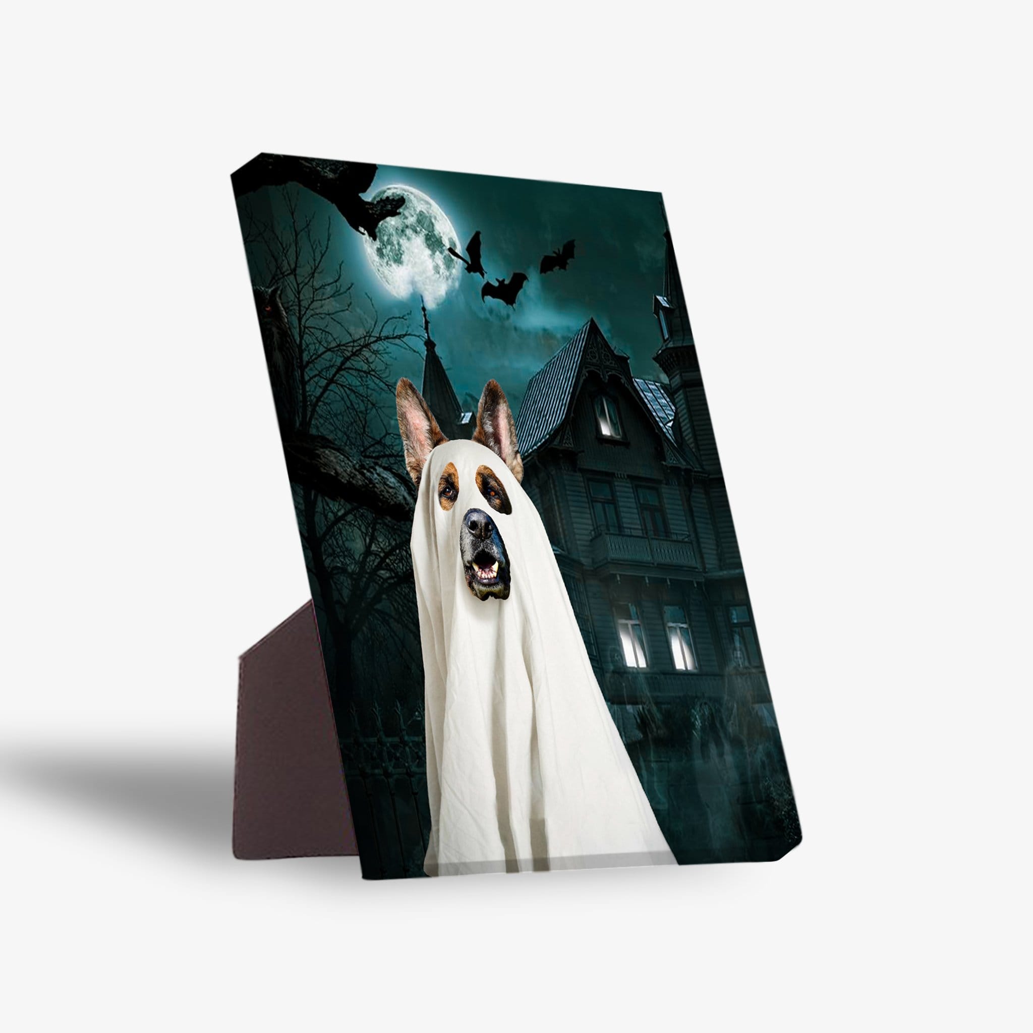 Personalized pet standing canvas featuring a dog in a ghost costume against a spooky haunted house and moonlit sky.