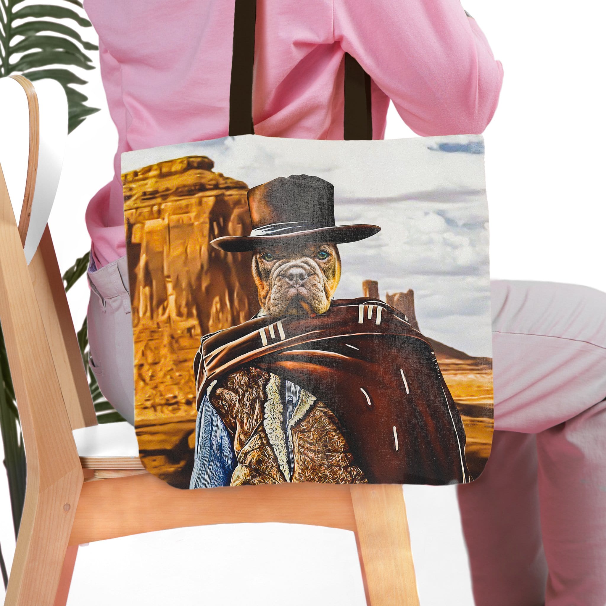 Personalized tote bag with a custom pet portrait of a dog dressed as a cowboy in a desert landscape.
