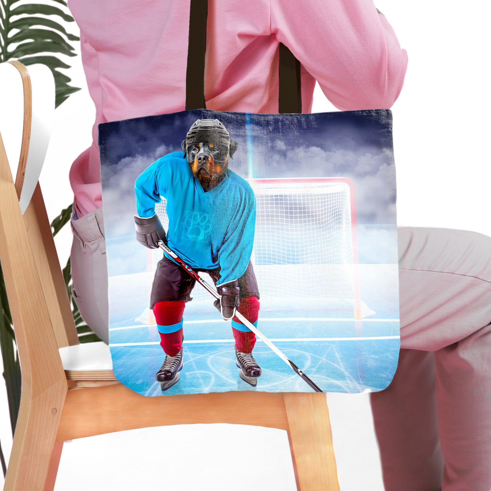 Personalized tote bag with a custom pet portrait of a Rottweiler dog as a hockey player.