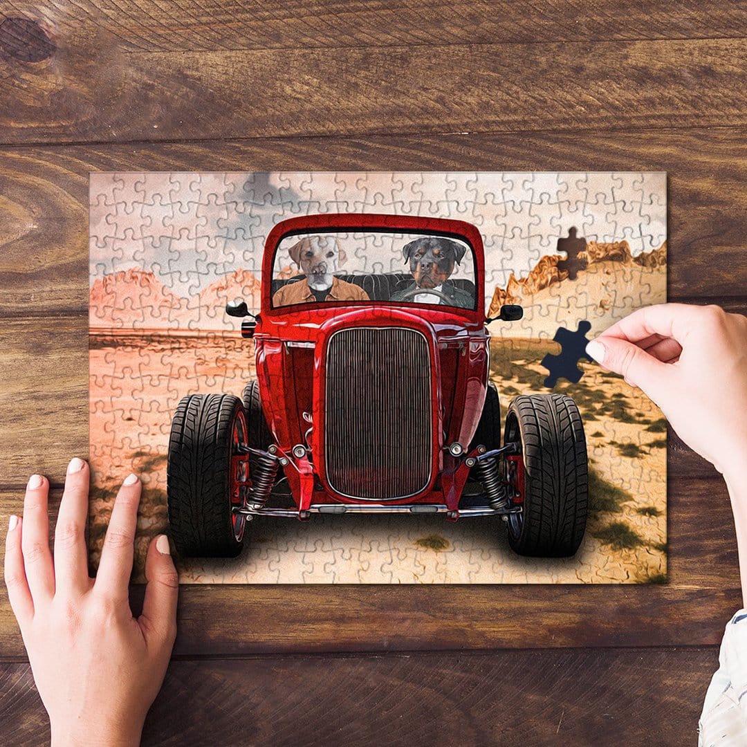 Personalized 2 pet puzzle featuring dogs in a red hot rod car, partially assembled on a wood table.