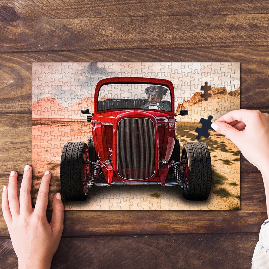Personalized pet puzzle featuring a dog driving a red hot rod, with a hand placing a piece.