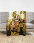 Personalized pet blanket with a boxer dog in a hunter portrait, draped over a gray sofa.