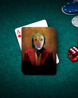Custom pet portrait playing card featuring a dog as The Joker, on a green felt table with poker chips and dice.