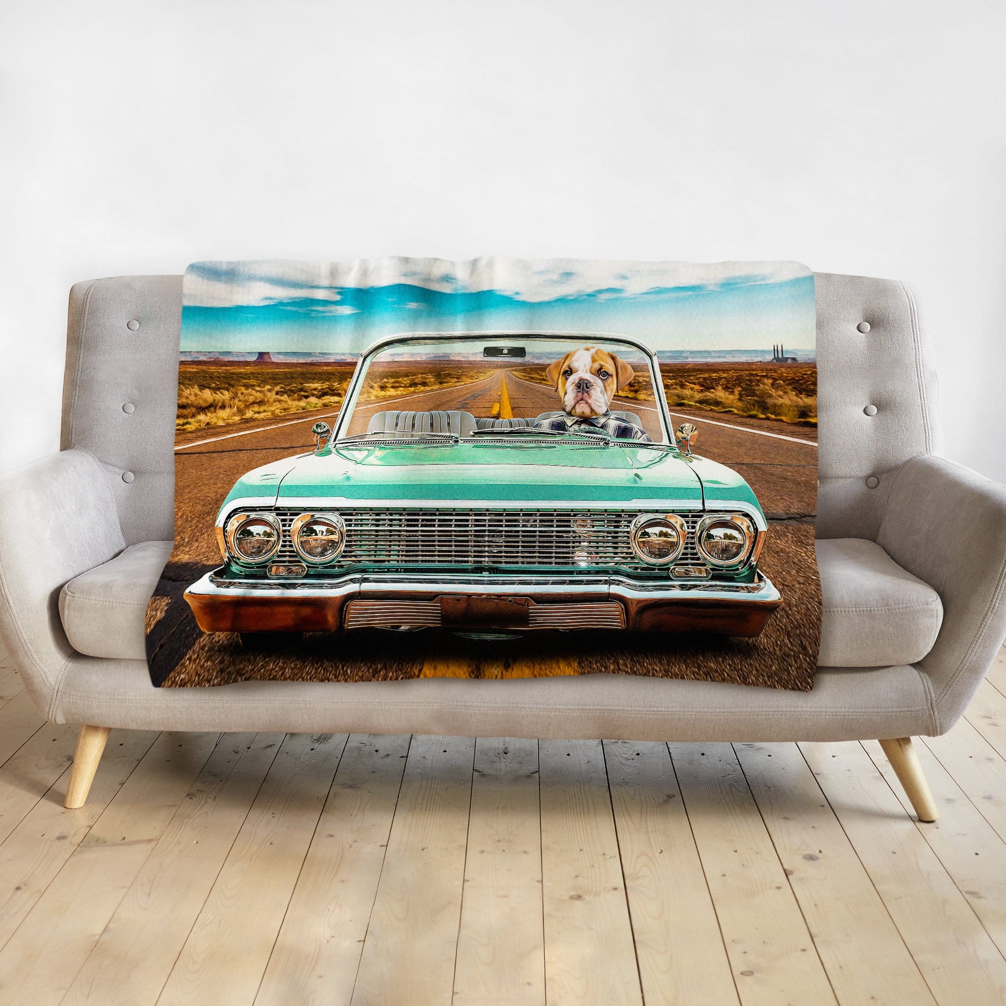 Personalized pet blanket with a bulldog driving a teal lowrider car on a desert road.