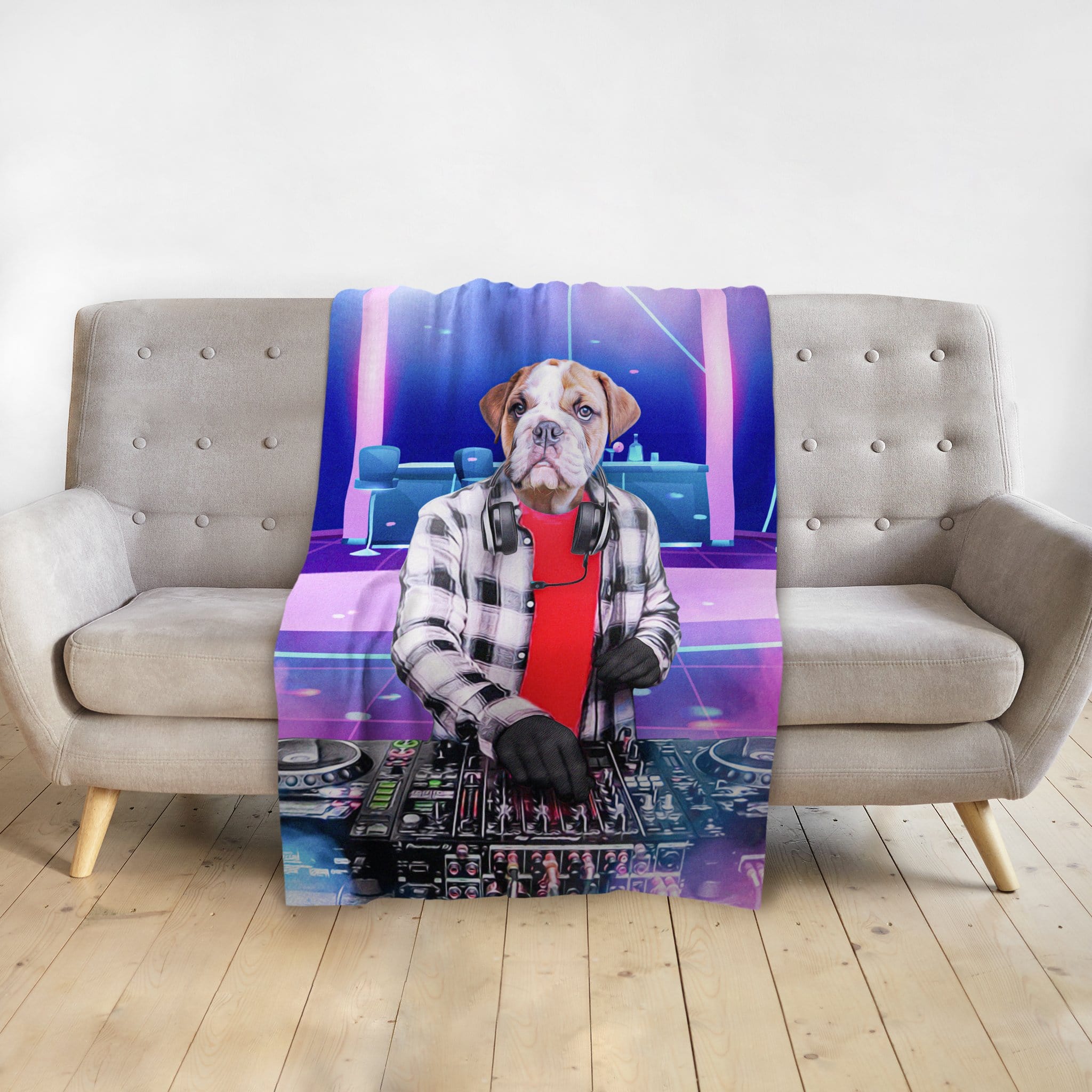 Personalized pet blanket with a bulldog DJ portrait design, draped over a light gray sofa.