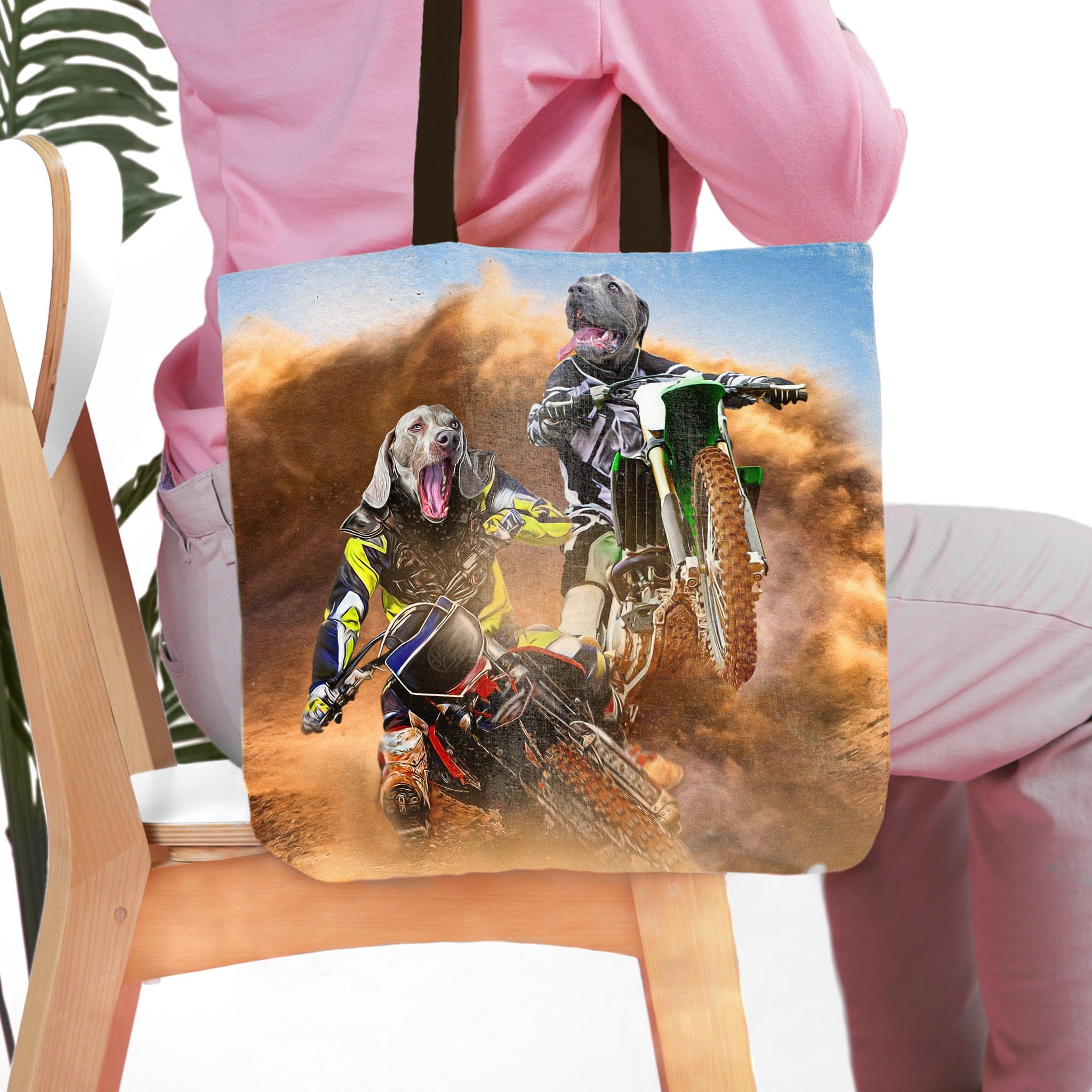Personalized pet portrait tote bag featuring two dogs as motocross riders in a dusty race.