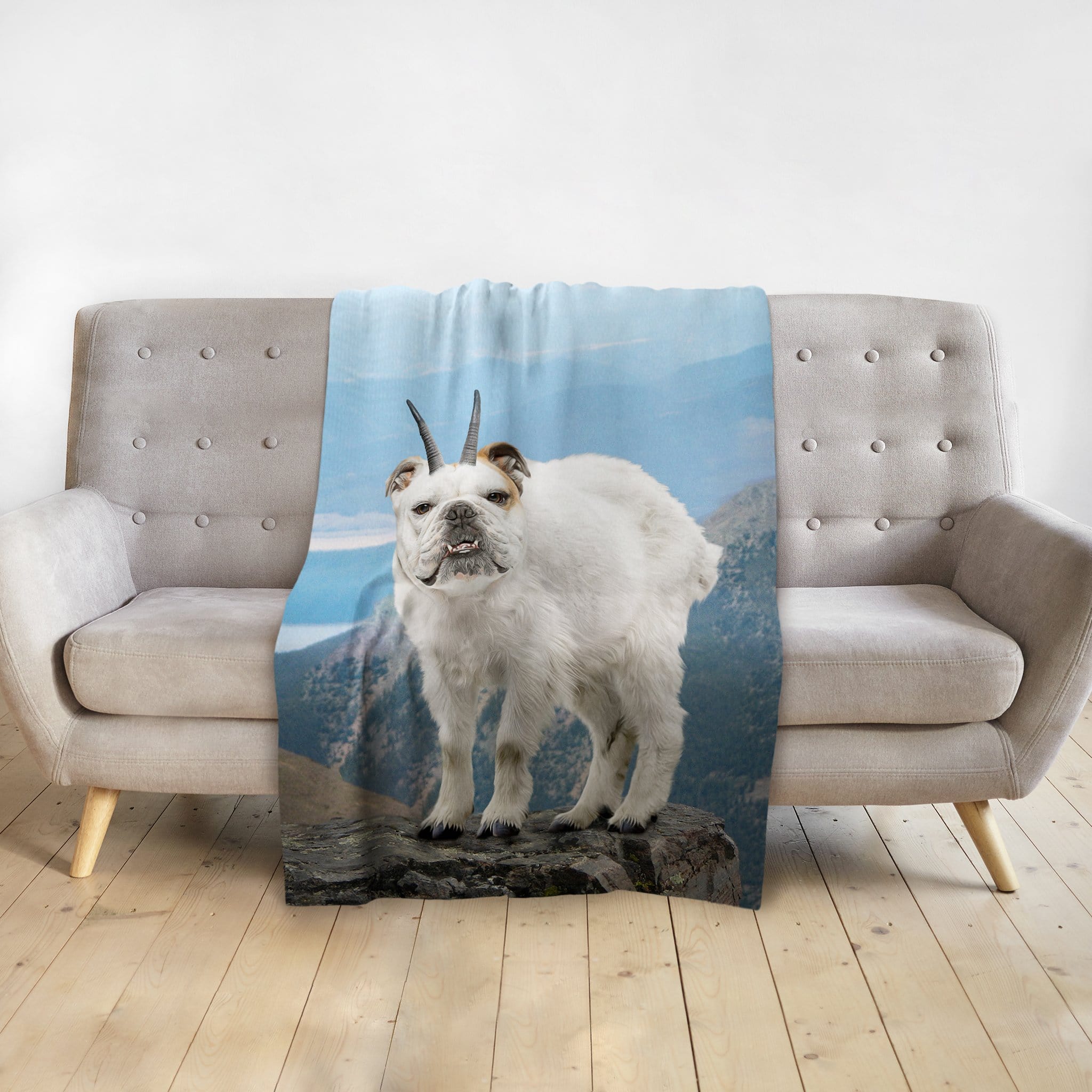 Personalized pet blanket with a Doggovinci portrait of a bulldog-goat hybrid on a mountain.