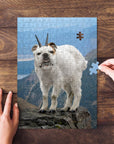 Personalized pet puzzle featuring a bulldog's face on a white doggoat body, standing on a mountain.