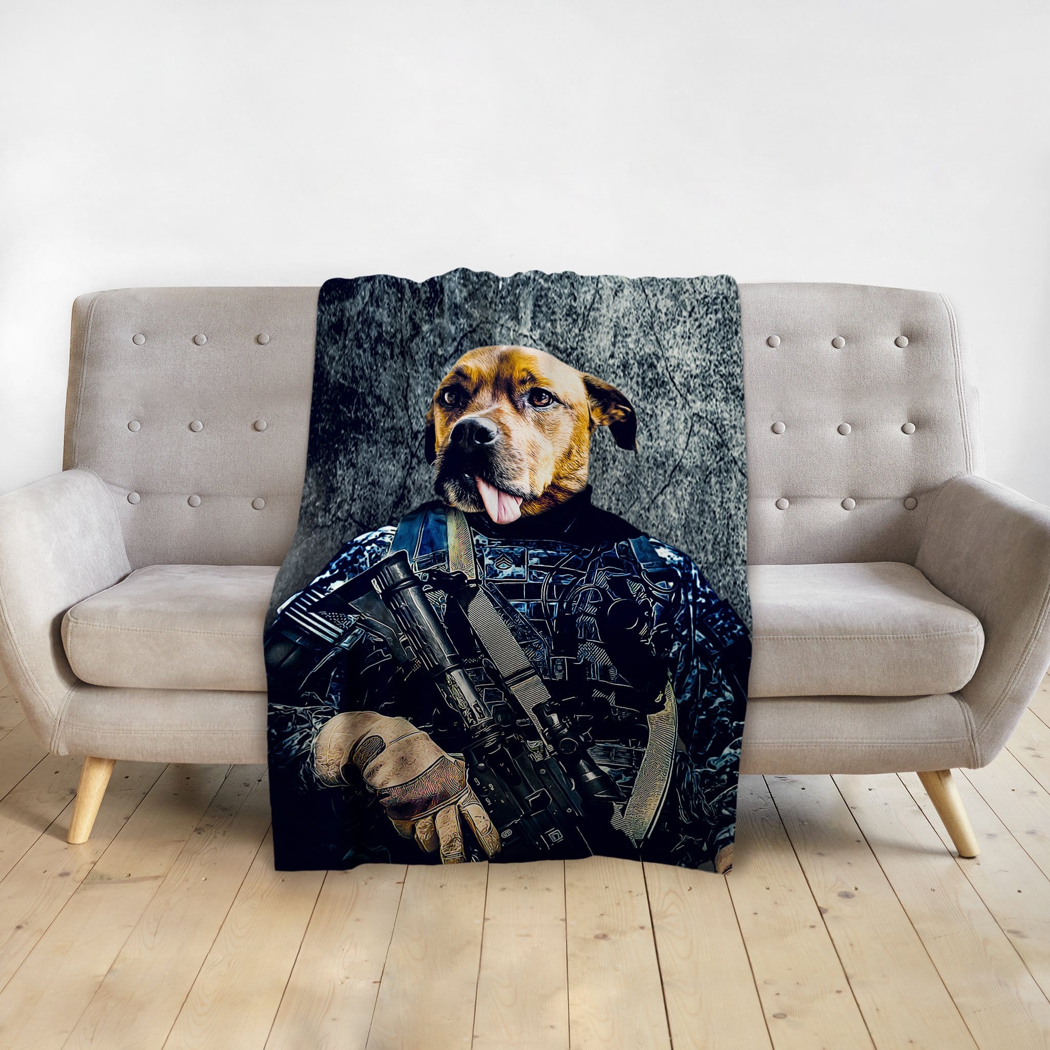 Personalized pet blanket featuring a dog in a navy veteran portrait, draped over a beige sofa.