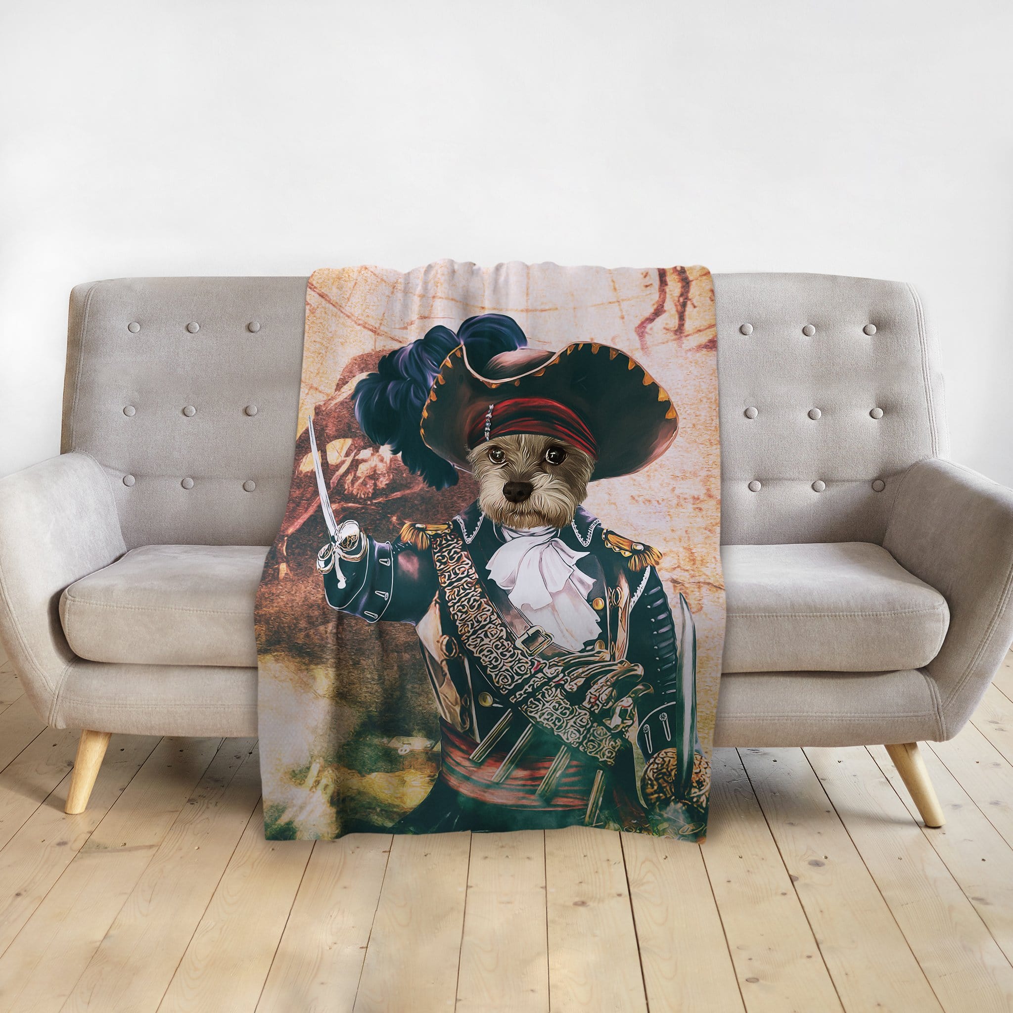 Personalized pet blanket with a dog's portrait as a pirate captain, draped over a gray sofa.