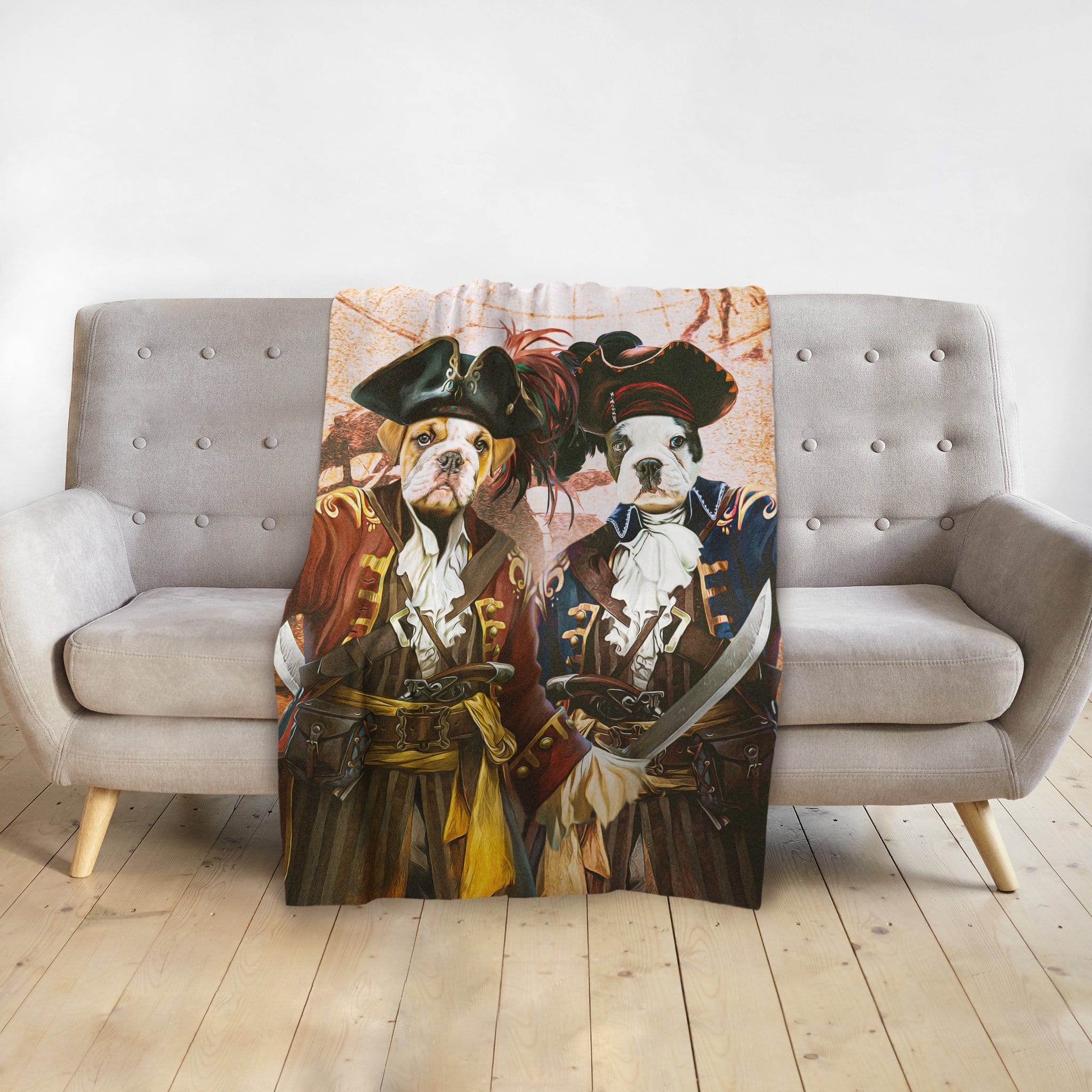 Personalized 'The Pirates' custom pet portrait blanket featuring two dogs in pirate costumes on a grey couch.