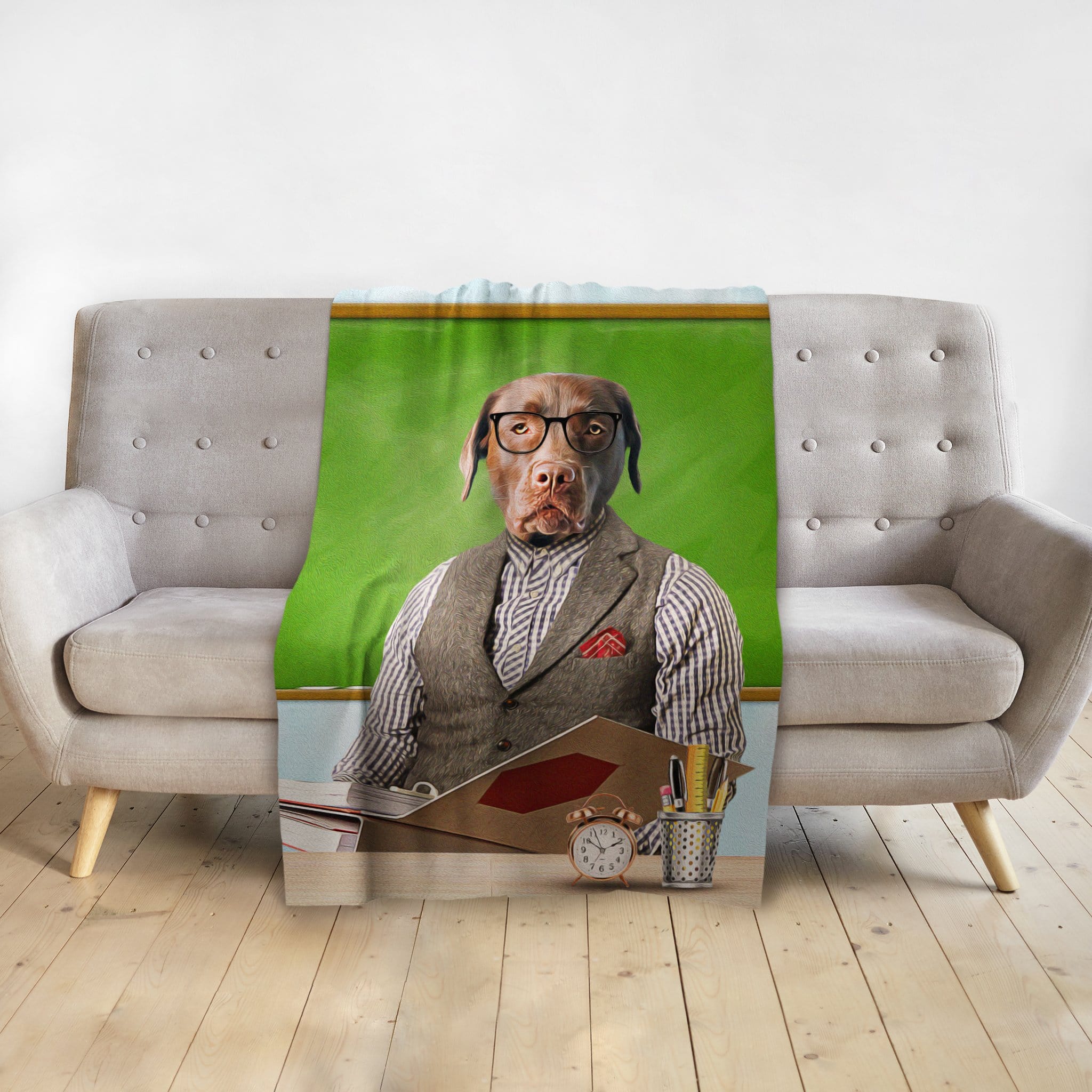 Personalized pet blanket featuring a chocolate lab dog in a teacher portrait style, draped over a gray sofa.