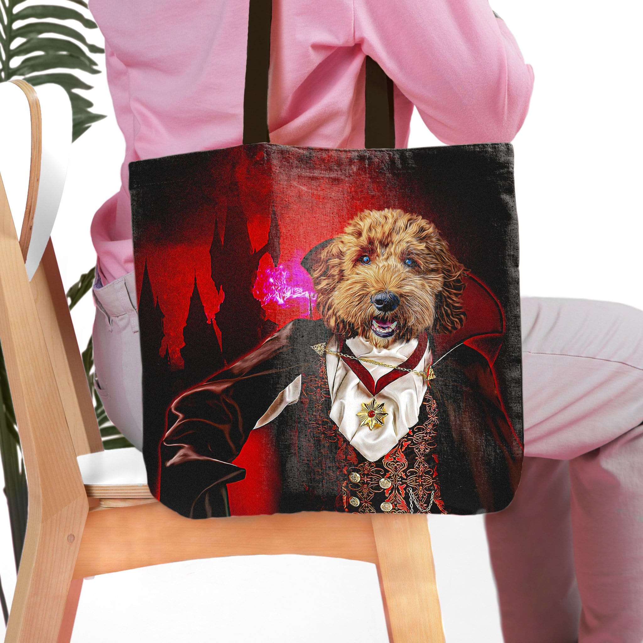 Personalized black tote bag with a custom dog pet portrait in a vampire costume against a red castle background.