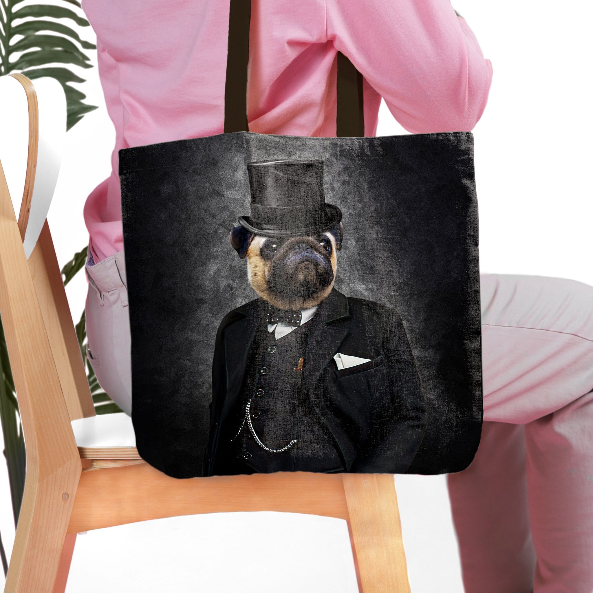 Personalized black tote bag with a royal renaissance portrait of a pug in a top hat and suit.