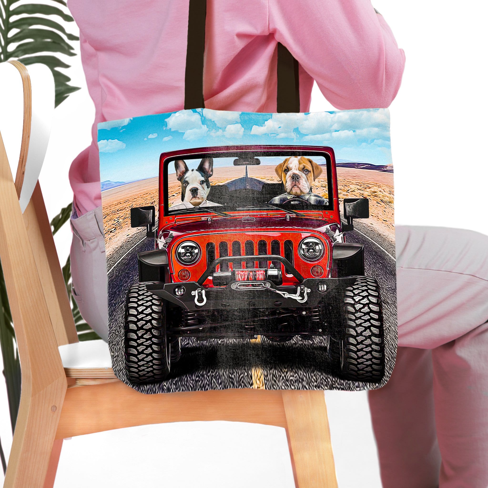 Personalized pet portrait tote bag featuring two dogs in a red jeep, desert background.