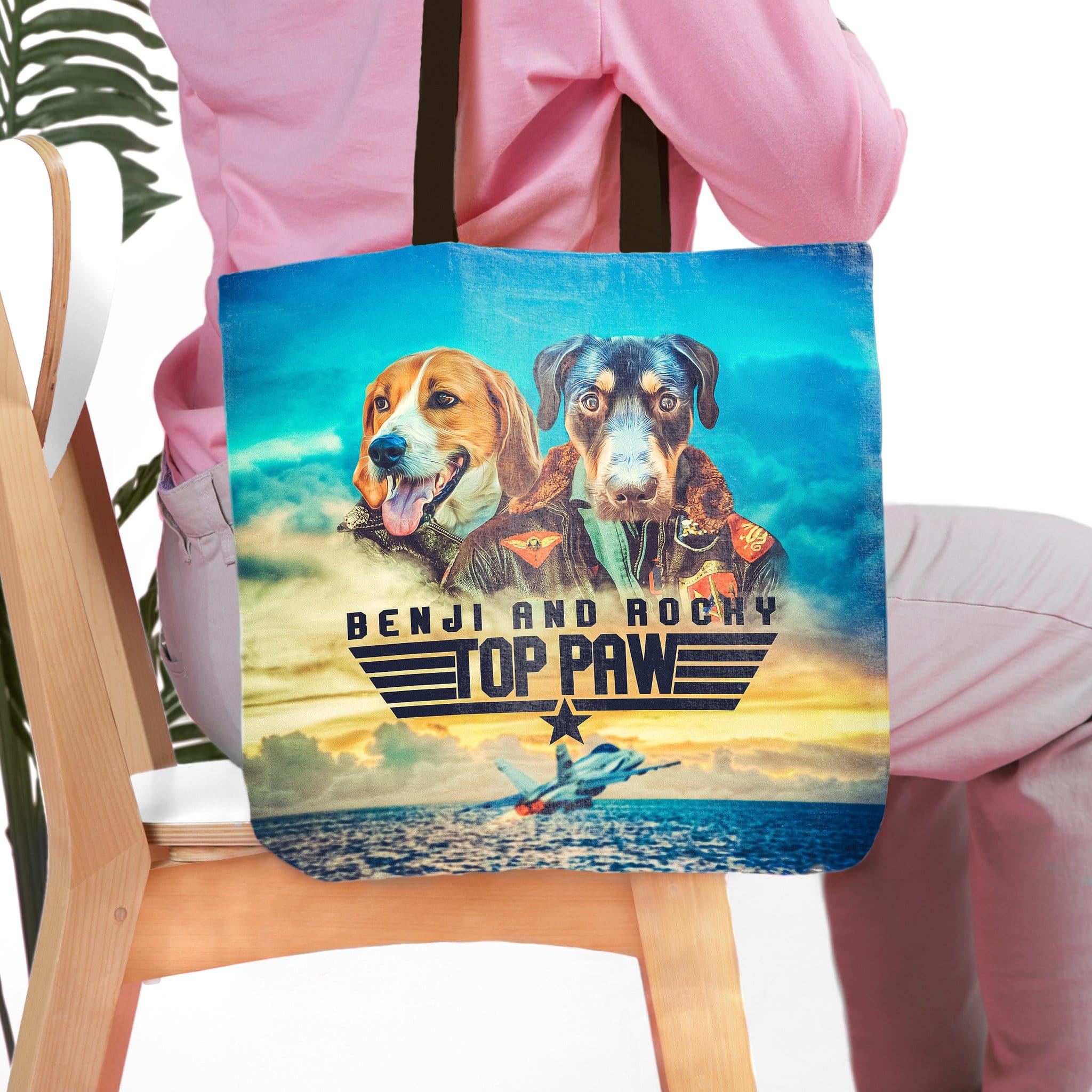 Personalized Top Paw tote bag with two dogs in pilot outfits and a jet flying over water.