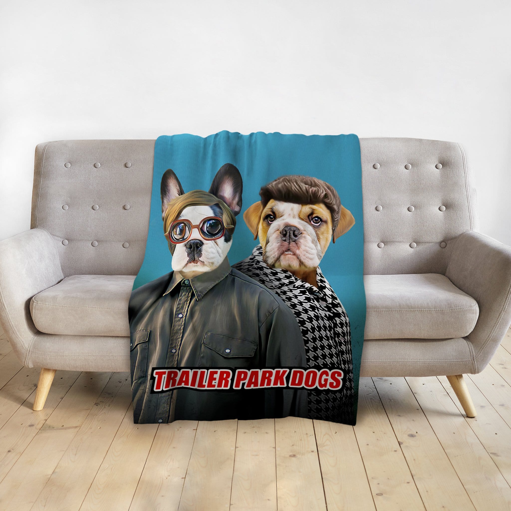 Personalized pet blanket with two dogs in "Trailer Park Dogs" style on a gray couch.