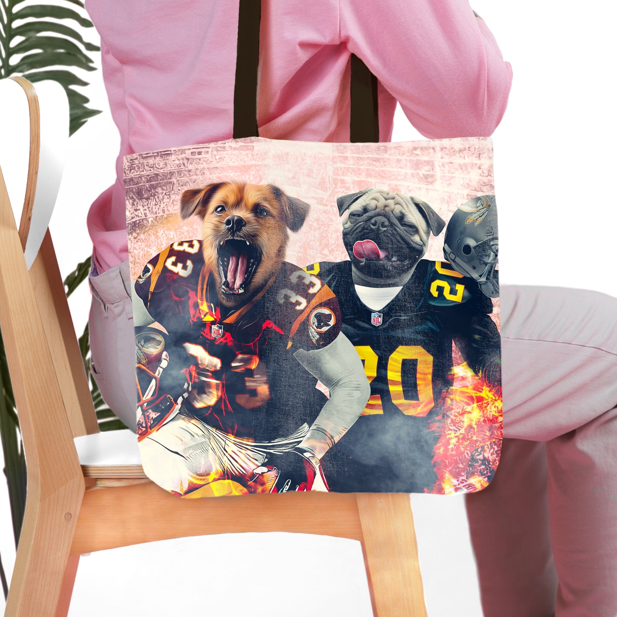 Personalized pet portrait tote bag featuring two dogs in football uniforms.